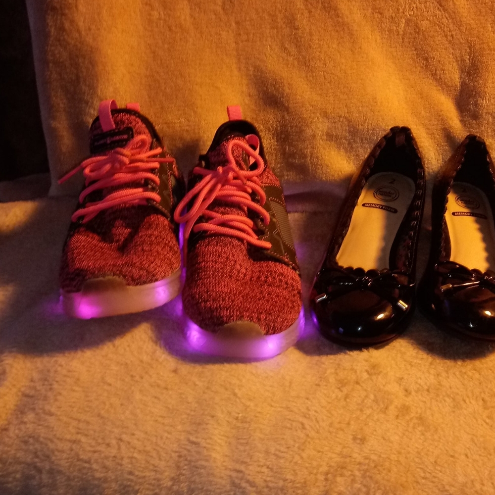 Two pairs of girl shoes one for work one for play